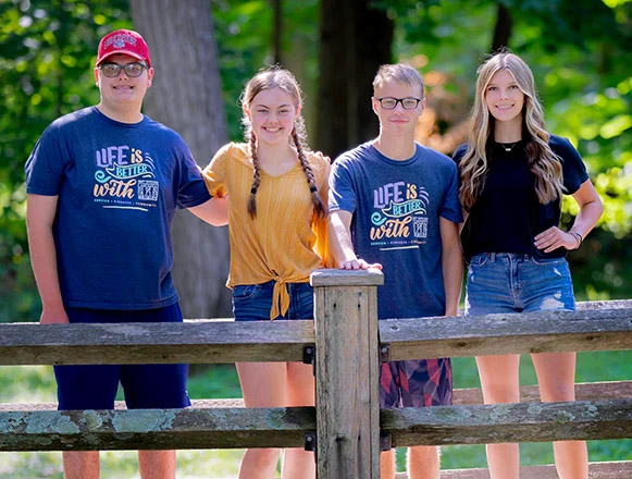 image of people volunteering at an event check in station
