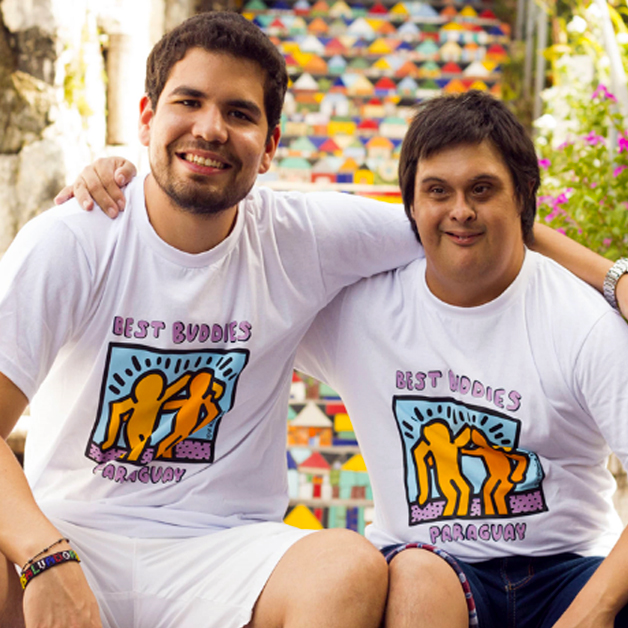 Latin America Landing Page: One-to-One-Friendships Pillar image A pair of Best Buddies Paraguay Friendship Guy Participants embrace each other