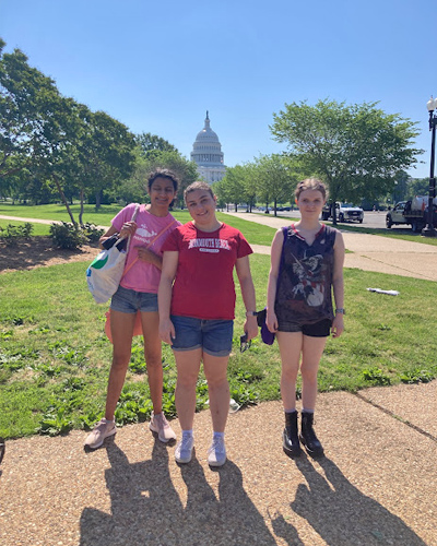 bb-living-sleepover-4 Three Best Buddie's girls Sleepover participants pose in front of the Capital Building in Washington, D.C. on a sunny day.