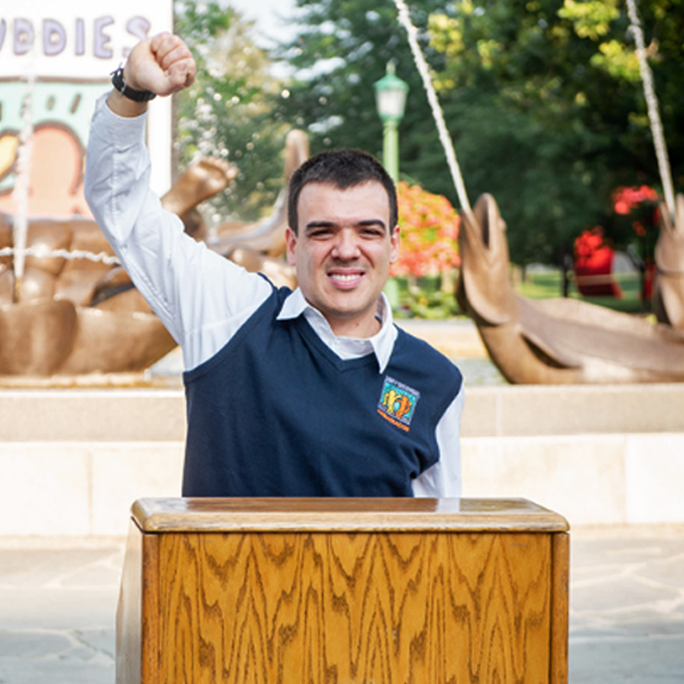 Latin America Landing Page: Leadership Development Pillar image A Best Buddies Leadership Development participant speaks from a wooden podium.